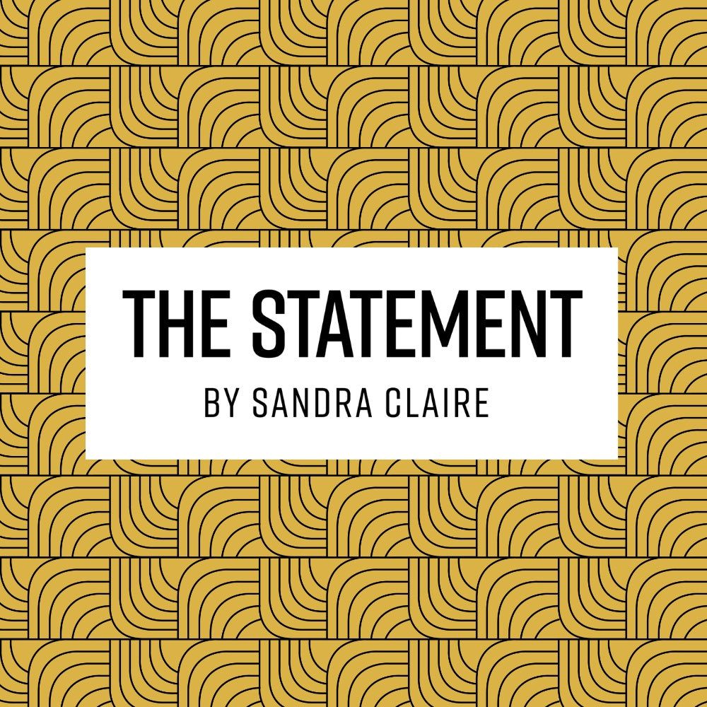 Book cover with 'The Statement by Sandra Claire' text on a gold geometric patterned background